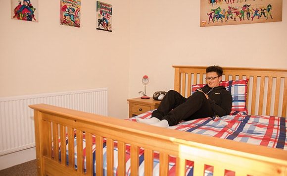 Braidley House - Boy in room